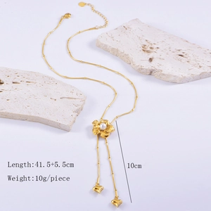Detail of flower necklace showing 41.5cm length with pearl and heart pendant