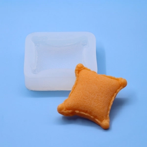 Close-up of pillow-shaped silicone mold with textured surface for DIY mousse and fondant