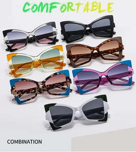 Close-up of seven assorted butterfly cat-eye sunglasses in vibrant patterns and colors