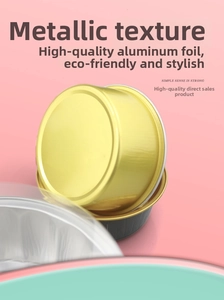 Detail view of high-quality aluminum foil baking cups with golden lids on pink background