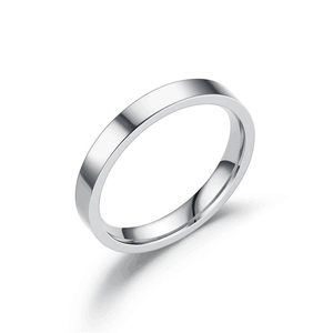 Close-up of minimalist silver titanium steel ring with a smooth flat surface design