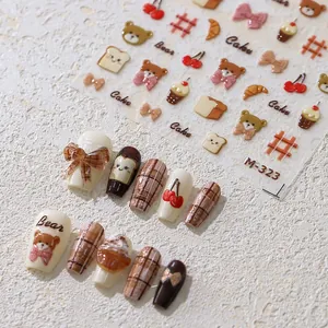 Detailed view of M-323 cartoon nail stickers with bear, cherry and plaid patterns
