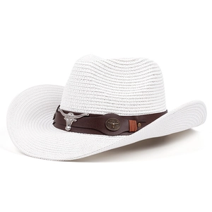 White straw cowboy hat with leather band and silver bull head emblem on white background