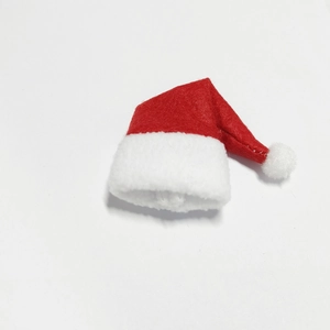 Mini red felt Christmas wine bottle hat with white plush trim on white background