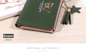 Close-up of green PU leather wallet featuring a gold butterfly buckle and star tassel
