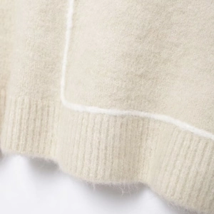 Minimalist knit sweater in beige featuring ribbed hem with white contrast stitching