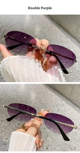 Detail of rimless oval sunglasses with purple gradient lenses and silver metal temples