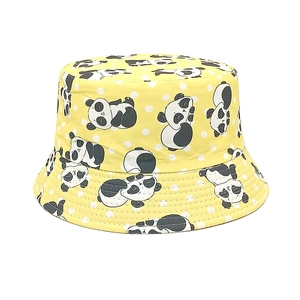 Close-up of yellow sun hat featuring cartoon panda prints and white polka dots pattern