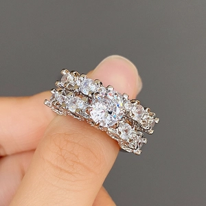 Exquisite silver-toned zircon ring set for couples featuring large round central gemstone