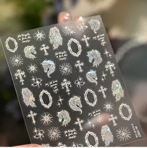 Detailed laser nail stickers featuring gothic horse and cross motifs on silver shell