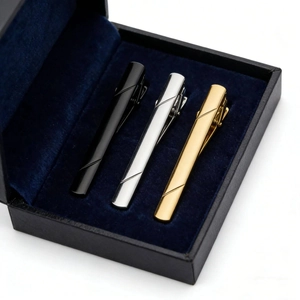 Three-piece stainless steel tie clip set with textured finish in a premium gift box