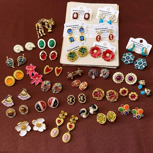 Collection of vintage court style earrings in diverse enamel and pearl designs