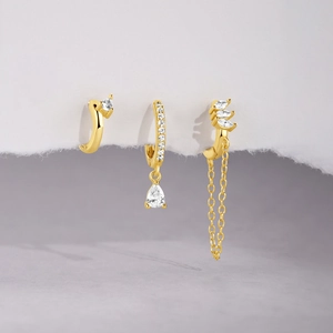 Detailed view of s925 silver gold earring set featuring marquise zircon and tassel chain