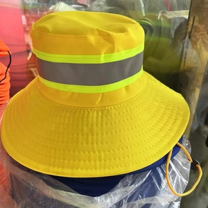 Close-up view of a high visibility yellow sun hat with a gray reflective safety band
