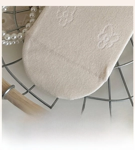 Detail of hand-linked seamless toe on beige cotton socks for smooth comfort