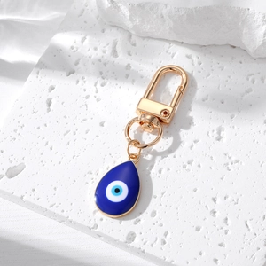 Teardrop evil eye pendant keychain in gold alloy and deep blue enamel finish