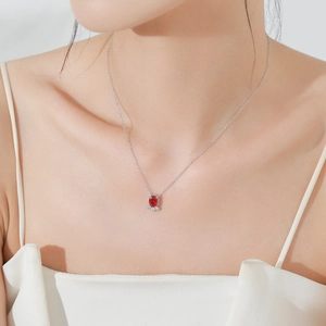 Elegant S925 sterling silver necklace with ruby goldfish pendant on a female model