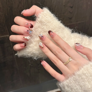 Elegant French Christmas press-on nails with wine red pearls and star rhinestones