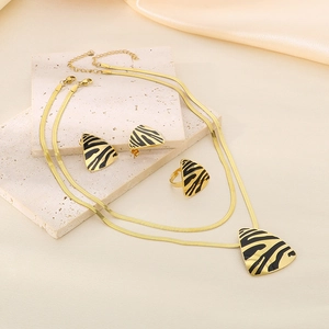 Modern 18K gold stainless steel jewelry set with zebra pattern triangles on stone base