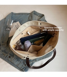 Top view of large canvas tote bag showing interior compartments and daily essentials