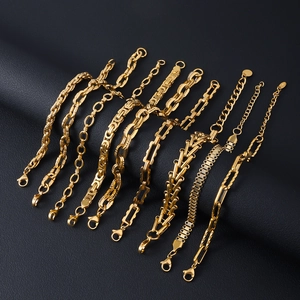 Set of 8 gold stainless steel bracelets including Cuban, snake, and box chain styles