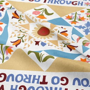 Detail of bohemian mandala tapestry fabric showing intricate floral patterns and soft texture