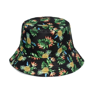 Black bucket hat with tropical fruit pineapple and palm leaf patterns for sun protection
