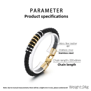 Detail view of woven black leather bracelet with stainless steel rings and gold lobster clasp