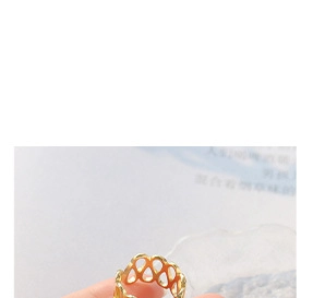 Detail of 18k gold plated stainless steel hollow mesh ring with intricate woven texture