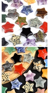 Close-up of assorted star-shaped natural crystals like amethyst and tiger eye stone