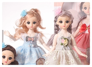 Detail of blonde and grey-haired dolls wearing elegant lace and floral dresses