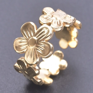 Adjustable golden flower ring featuring multiple daisy petals in a polished finish