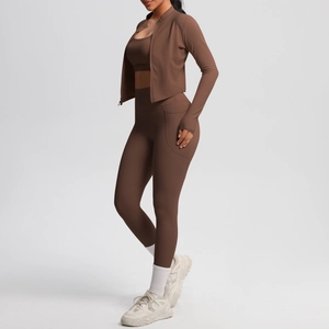 Detailed view of cocoa brown three-piece yoga set featuring side pockets and high waist