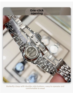 Macro view of the stainless steel back case and deployment clasp of a square quartz watch