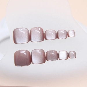 Cat-eye purple squoval press-on toenails with shimmering finish for elegant pedicure