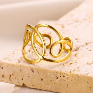 Abstract geometric teardrop gold plated stainless steel ring on stone pedestal