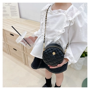 Quilted round crossbody bag for girls featuring a golden camellia and chain strap