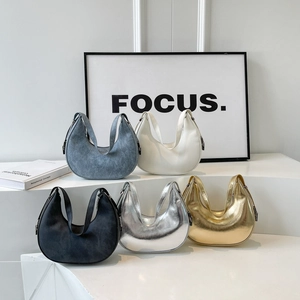 Minimalist crescent hobo bags in assorted colors including silver gold and denim blue