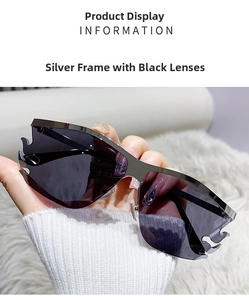 Close-up of rimless flame-shaped sunglasses with silver frame and black-gray lenses