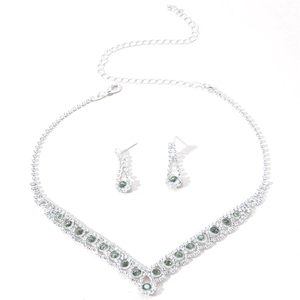 Silver bridal necklace and earrings set with green crystals and clear rhinestones