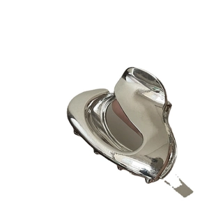 Polished silver metal shark hair claw clip for thick hair with a minimalist metallic finish
