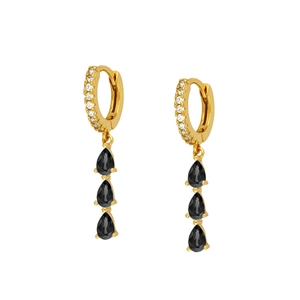 Close-up of gold hoop earrings with clear zircons and three black pear-shaped crystals