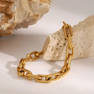 Minimalist gold chunky chain bracelet in 18K gold plated stainless steel on rock