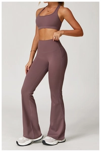 Detail of mauve high-waisted yoga flare pants with a functional side phone pocket