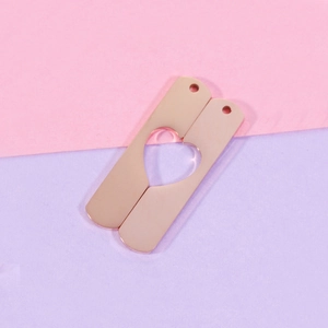Polished rose gold stainless steel matching couple bar pendants with heart cutout