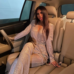 Sparkly champagne long sleeve sequin jumpsuit with deep V-neck and slim fit design
