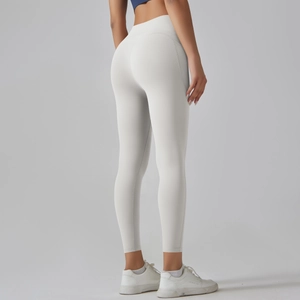 Macro view of high-waist light grey yoga leggings showing seamless butt-lifting fabric detail