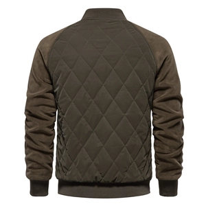 Rear view of brown quilted jacket with raglan sleeves and ribbed cuffs on white backdrop
