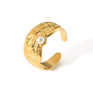 Detailed view of 18k gold lava texture ring with pearl and adjustable open band