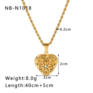 Detailed view of 2cm gold heart book locket with rhinestone inlay and chain dimensions